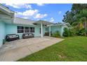 Inviting front patio with comfortable seating, perfect for enjoying the outdoors at 1825 Welland Dr, Clearwater, FL 33756