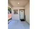 Home entryway featuring a light blue door, neutral stucco, and a 'Welcome' sign at 2612 E 26Th Ave, Tampa, FL 33605