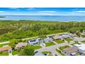 Charming neighborhood setting, with verdant landscaping and proximity to natural waterways, creating serene backdrop at 3519 Richboro Dr, Holiday, FL 34691