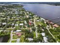 Aerial view of a home on the water showing the proximity to the river and other surrounding properties at 358 Highland Shores Dr, Ellenton, FL 34222