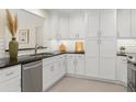 Modern kitchen featuring white cabinets, subway tile backsplash, and stainless steel appliances at 358 Highland Shores Dr, Ellenton, FL 34222