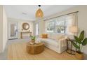 Living room with gray floor, lots of natural light, and white walls at 358 Highland Shores Dr, Ellenton, FL 34222
