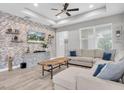 Comfortable living room with a large sectional sofa and accent wall at 3800 Night Star, Odessa, FL 33556