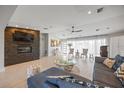 Bright living room featuring a fireplace, recessed lighting, and a large window offering ample natural light at 3956 Versailles Dr, Tampa, FL 33634