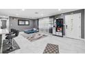 Open-concept space with sleek tile flooring, lots of light, and gray decor at 5895 16Th N St, St Petersburg, FL 33703