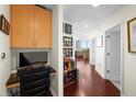 Hallway with wood floors, office space, and wine storage leading to living area at 777 N Ashley Dr # 1903, Tampa, FL 33602