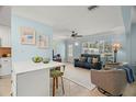 Bright living room with stylish furnishings, open to the kitchen with a breakfast bar for easy entertaining at 791 66Th S Ave, St Petersburg, FL 33705