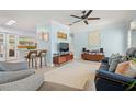 Bright and airy living room featuring tile floors and stylish contemporary furnishings at 791 66Th S Ave, St Petersburg, FL 33705