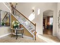Beautiful staircase with wood and iron accents, bathed in natural light at 8358 Dunham Station Dr, Tampa, FL 33647