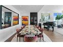 Elegant dining room with modern decor, large mirror, and an eye-catching art collection at 100 1St N Ave # 3905, St Petersburg, FL 33701