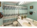 Bathroom featuring a sink and a shower with a decorative curtain at 112 Sun Isle Cir # 112, Treasure Island, FL 33706