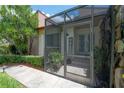 Enclosed front patio with a screened entry and a 