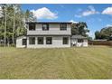 Large backyard showcasing a well-maintained lawn, perfect for outdoor activities and entertaining at 19003 Cedar Ln, Lutz, FL 33548