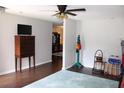 Inviting living room with hardwood floors, neutral walls, and ample natural light at 2101 Sunset Point Rd # 2304, Clearwater, FL 33765