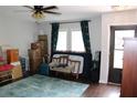 Cozy living room with wood floors, a plush rug, and natural light streaming through the windows at 2101 Sunset Point Rd # 2304, Clearwater, FL 33765