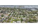 Aerial view showcasing the home's location near the water and surrounding neighborhood at 316 Cedar Ln, Largo, FL 33770