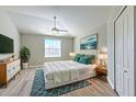 Calming main bedroom with hardwood floors, plenty of natural light, and a serene atmosphere at 5046 Gato Del Sol Cir, Wesley Chapel, FL 33544