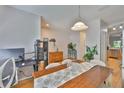 Bright dining area with hardwood floors and views into other living spaces at 5717 Fishhawk Ridge Dr, Lithia, FL 33547