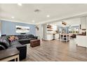 Open-concept living room and kitchen with hardwood floors, recessed lighting, and updated modern design at 6844 34Th N Ave, St Petersburg, FL 33710