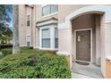 Charming home exterior featuring a welcoming front door, bay window, and beautifully maintained landscaping for added curb appeal at 10436 Villa View Cir, Tampa, FL 33647