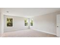 Spacious bedroom with three large windows offering plenty of natural light at 12758 Oak Hill Way, Parrish, FL 34219