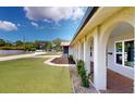 Home exterior showcasing brick columns and an arched walkway leading to the front door at 140 88Th Ne Ave, St Petersburg, FL 33702