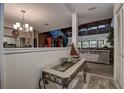 Open entryway featuring stylish decor and seamless transition to the living room and kitchen at 140 Dale Pl, Oldsmar, FL 34677