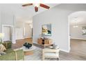 Bright living room showcasing stylish decor, neutral walls, and seamless flow into other living spaces at 19113 Golden Cacoon Pl, Lutz, FL 33558