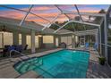 Enjoy outdoor living with this screened-in pool area perfect for entertaining and relaxation at 19113 Golden Cacoon Pl, Lutz, FL 33558