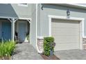 Charming home exterior with a one car garage and a security system at 2507 Arbor Wind Dr, Lutz, FL 33558