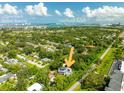 Gorgeous aerial view of home, showcasing its proximity to Sand Key and Belleair Beaches, plus Clearwater Beach at 321 Barbara Cir, Belleair, FL 33756