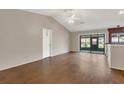 Bright, open living room with wood floors, sliding glass doors, and high ceilings at 3902 Shoreside Cir, Tampa, FL 33624