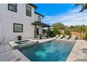 Resort-style backyard featuring a sparkling pool, spa, and ample lounge space perfect for entertaining at 468 44Th N Ave, St Petersburg, FL 33703