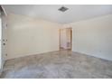 Bright living room features neutral paint, tile floors, and ample natural light at 5390 Magnolia N Trl, Pinellas Park, FL 33782
