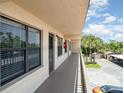 Balcony view showcasing the outdoor landscape and proximity to parking in this condo community at 635 30Th W Ave # F309, Bradenton, FL 34205