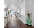Inviting condo hallway with stylish décor and hardwood floors leading into an open-concept kitchen and living area at 777 N Ashley Dr # 2312, Tampa, FL 33602