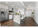 Modern condo kitchen with stainless steel appliances, granite countertops, and eat-in bar with seating at 777 N Ashley Dr # 2312, Tampa, FL 33602