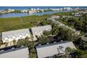 Scenic aerial view of the neighborhood showcasing lush greenery and waterfront proximity at 9660 Tara Cay Ct # 38, Seminole, FL 33776