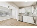 Kitchen and dining space with stainless steel appliances and modern finishes at 10215 N 23Rd St, Tampa, FL 33612