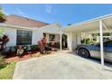 Cozy single-story home with a covered carport and lovely landscaping surrounding the property at 10636 Millriver Dr, New Port Richey, FL 34654
