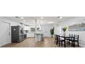 An interior shot of the dining room, featuring updated appliances, cabinetry, flooring and lighting at 2333 Indigo Dr, Clearwater, FL 33763
