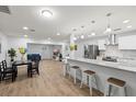 An open-concept space with an island, dining area, and a connected living room area at 2333 Indigo Dr, Clearwater, FL 33763