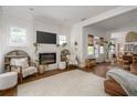 Bright living room features a modern fireplace, cozy seating, and an open floor plan for easy entertaining at 2412 W Prospect Rd, Tampa, FL 33629