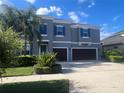 Charming two-story home featuring a well-maintained yard and a convenient two-car garage at 33191 Azalea Ridge Dr, Wesley Chapel, FL 33545