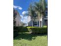 Well-manicured side yard with lush green grass and hedges, offering privacy and space at 33191 Azalea Ridge Dr, Wesley Chapel, FL 33545