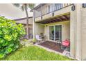 Charming outdoor patio space, perfect for relaxing or entertaining, with a view of the lush green surroundings at 4215 E Bay Dr # 1706A, Clearwater, FL 33764