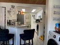 Eat-in kitchen boasts counter seating, stainless steel appliances, and plenty of natural light at 4219 Gray Squirrel Ln, New Port Richey, FL 34653