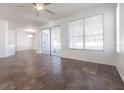 Bright living room features tile flooring and a sliding glass door that lets in plenty of natural light at 5017 46Th W St, Bradenton, FL 34210