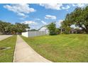 Spacious front yard and home along a sidewalk at 602 Hillpoint Way, Brandon, FL 33510