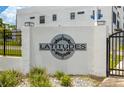 Close-up of the community sign 'Latitudes in the Park' at the entrance at 6206 64Th N Way, Pinellas Park, FL 33781